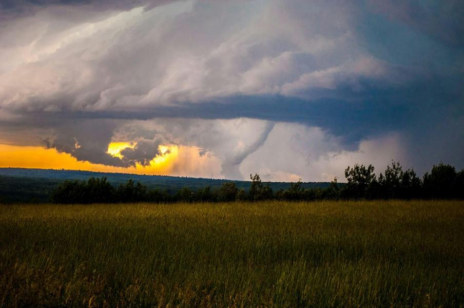 Tornado forming over field