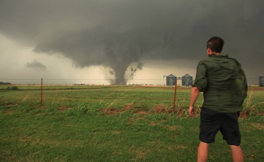 Reed Timmer standing in front of a tornado